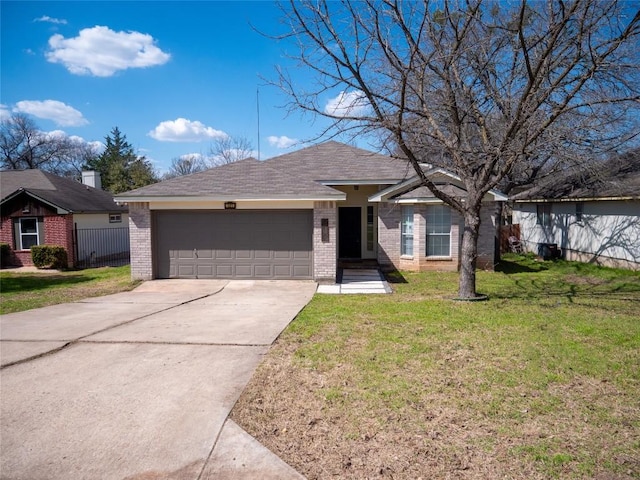 121 Winecup Path, Cedar Creek, TX 78612 - ranch-style house with brick siding, an attached garage, and concrete driveway