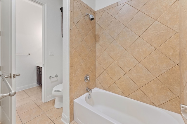 bathroom featuring toilet, washtub / shower combination, vanity, tile patterned flooring, and baseboards