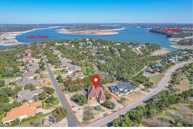 birds eye view of property with a water view and a residential view