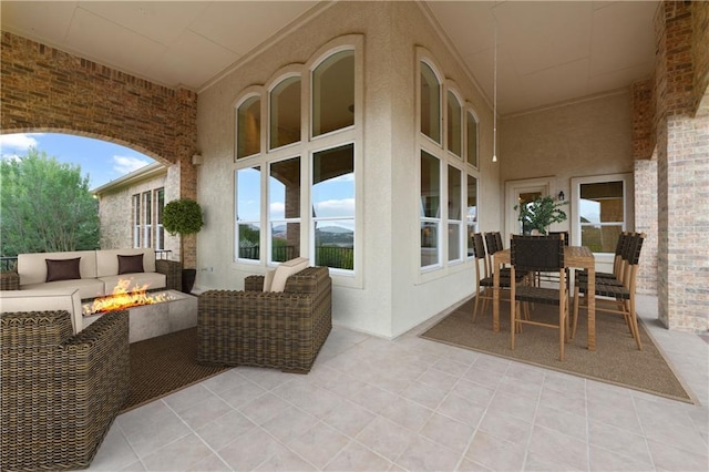 view of patio featuring an outdoor living space with a fire pit