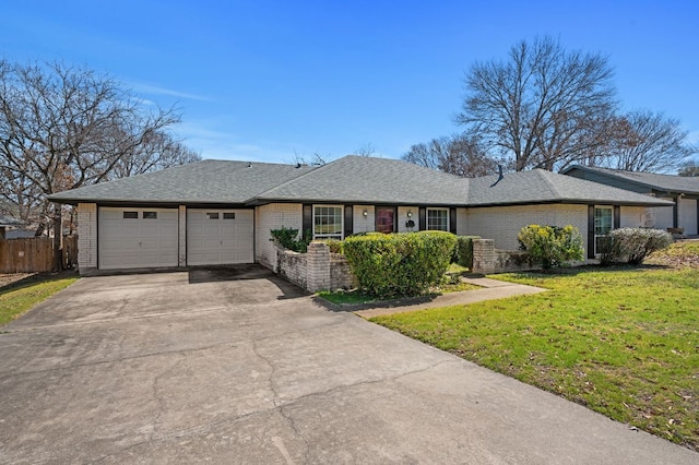 single story home with brick siding, concrete driveway, fence, a garage, and a front lawn