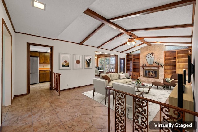 living area featuring lofted ceiling with beams, ceiling fan, built in shelves, a textured ceiling, and a brick fireplace