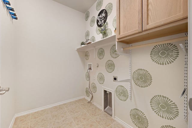 washroom featuring washer hookup, hookup for a gas dryer, cabinet space, hookup for an electric dryer, and baseboards