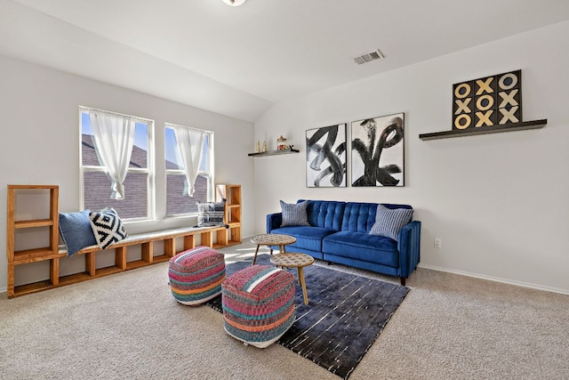 living area featuring lofted ceiling, carpet flooring, visible vents, and baseboards