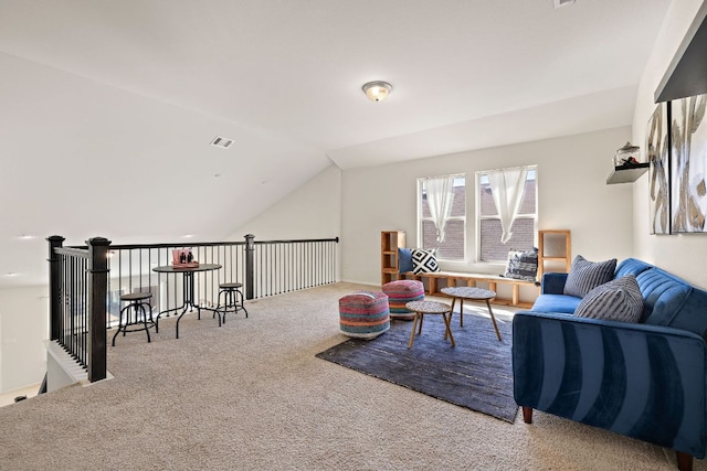 living area featuring lofted ceiling, visible vents, and carpet floors