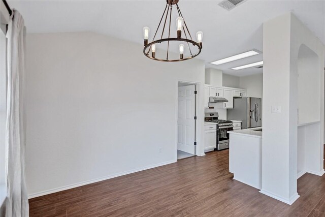 17616 Strontian Pass, Pflugerville, TX 78660 - kitchen with appliances with stainless steel finishes, under cabinet range hood, white cabinetry, a chandelier, and dark wood-type flooring