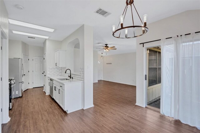 17616 Strontian Pass, Pflugerville, TX 78660 - kitchen with a sink, light countertops, a ceiling fan, a chandelier, and stainless steel appliances