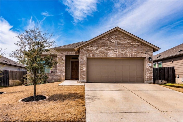 ranch-style home featuring a garage, driveway, fence, and brick siding