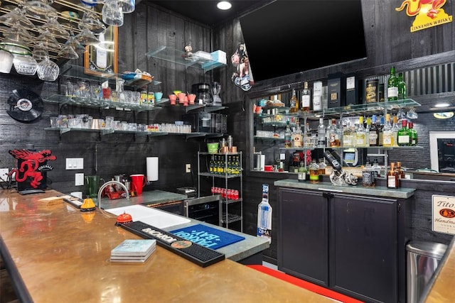 bar featuring indoor wet bar and a sink