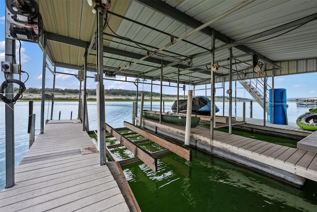 dock area featuring a water view and boat lift