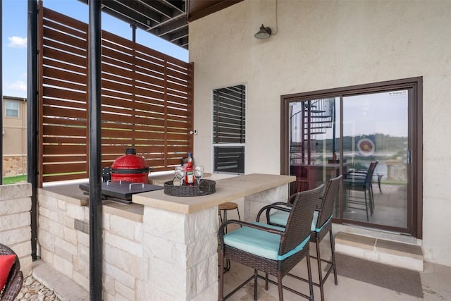 view of patio with outdoor dry bar