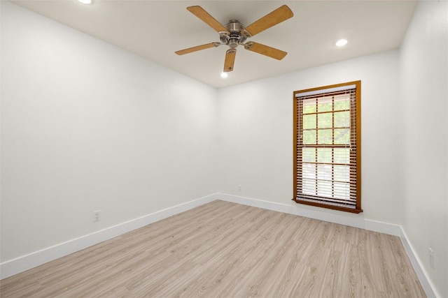 empty room with light wood finished floors, baseboards, a ceiling fan, and recessed lighting