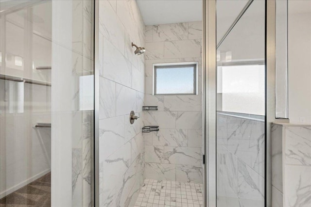 full bath with a marble finish shower
