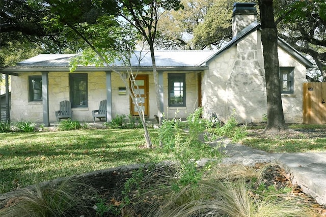 4708 Shoalwood Ave, Austin, TX 78756 - ranch-style house featuring covered porch, stone siding, a front lawn, and concrete block siding