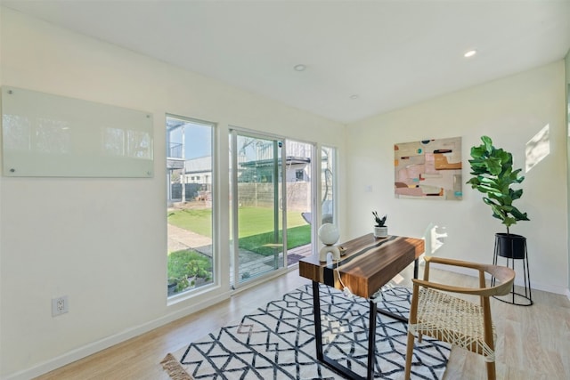 office area featuring recessed lighting, light wood-type flooring, and baseboards