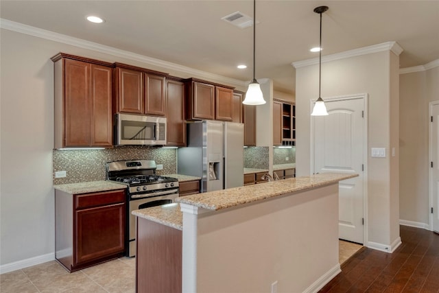 kitchen with tasteful backsplash, appliances with stainless steel finishes, visible vents, and crown molding