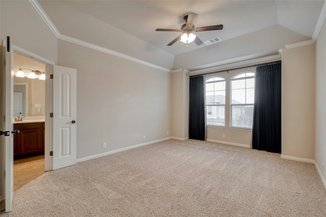 empty room featuring baseboards, visible vents, ornamental molding, and light colored carpet