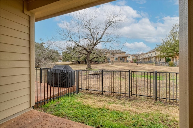 view of yard with a residential view and fence