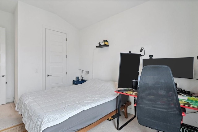 bedroom featuring lofted ceiling