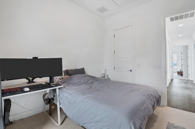 bedroom featuring recessed lighting, visible vents, and wood finished floors