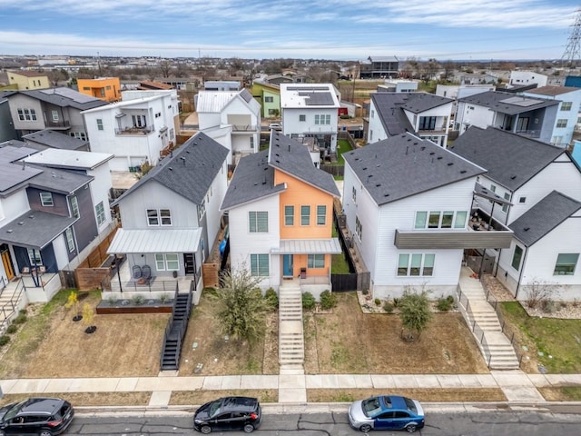 birds eye view of property with a residential view