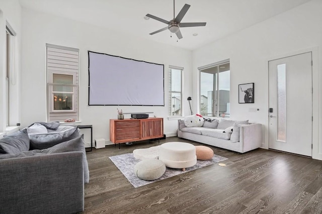 home theater featuring wood finished floors and a ceiling fan