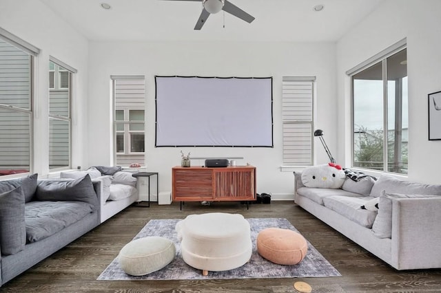 home theater room with a ceiling fan, recessed lighting, baseboards, and wood finished floors