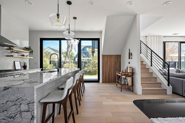 1712 Nash Ave Unit A, Austin, TX 78704 - dining area with light wood finished floors, stairway, and recessed lighting