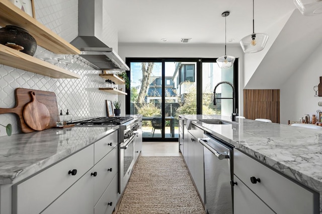 1712 Nash Ave Unit A, Austin, TX 78704 - kitchen with stainless steel appliances, wall chimney range hood, open shelves, a sink, and backsplash