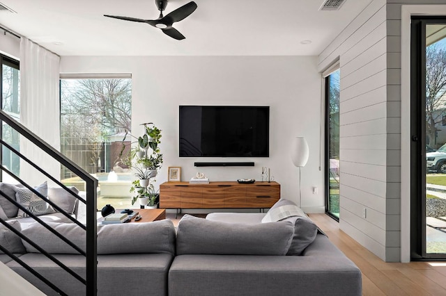 1712 Nash Ave Unit A, Austin, TX 78704 - living room featuring light wood finished floors, a ceiling fan, and stairway