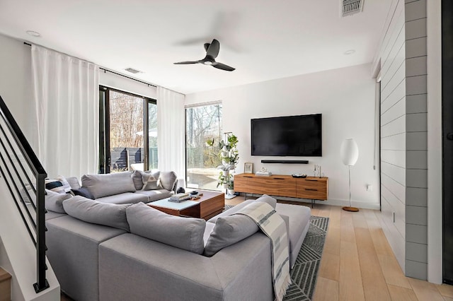 1712 Nash Ave Unit A, Austin, TX 78704 - living room with ceiling fan, light wood-style flooring, and stairs