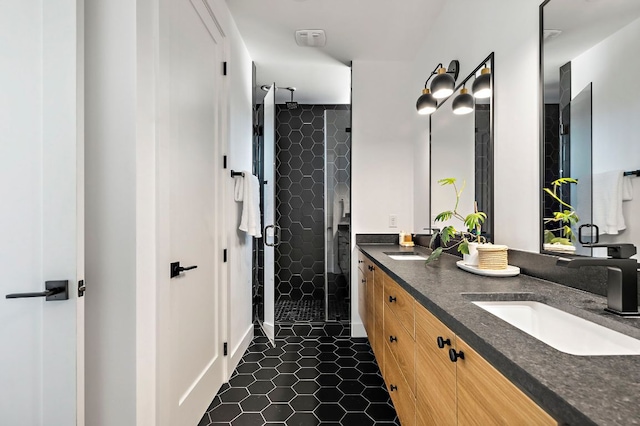 1712 Nash Ave Unit A, Austin, TX 78704 - bathroom featuring double vanity, a shower stall, and tile patterned floors