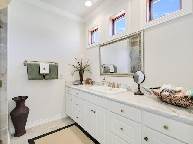 full bath featuring a tile shower, baseboards, marble finish floor, vanity, and ornamental molding
