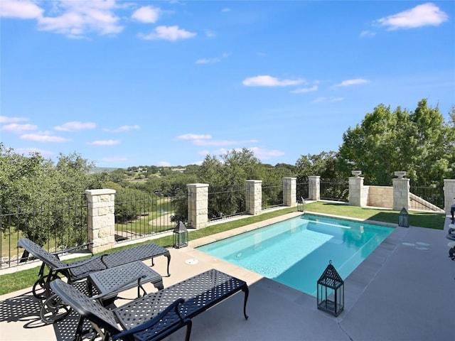 view of swimming pool with fence, a patio, and a fenced in pool