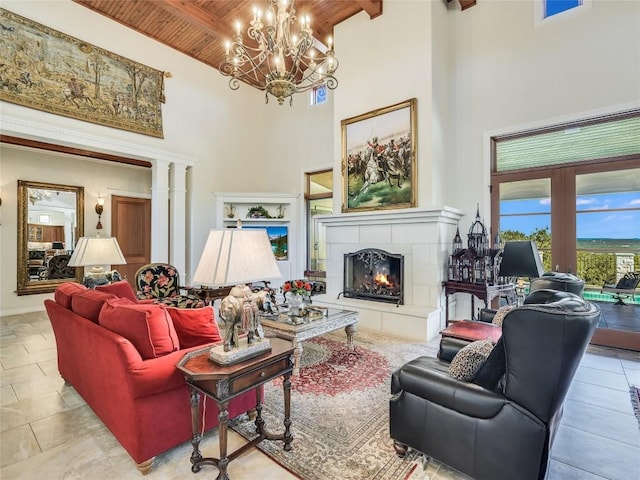 living room with wood ceiling, a high ceiling, beamed ceiling, and a fireplace