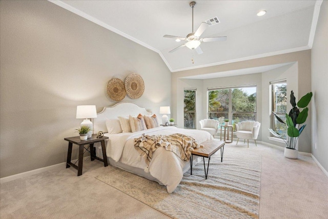 bedroom with visible vents, ornamental molding, light carpet, vaulted ceiling, and baseboards