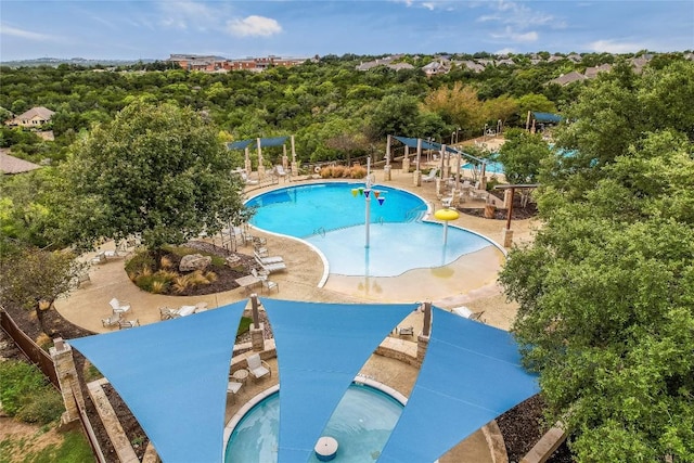 community pool featuring a water play area