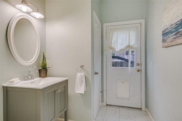 bathroom featuring vanity and baseboards