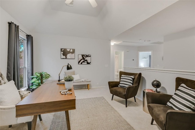 home office featuring light colored carpet, visible vents, and baseboards