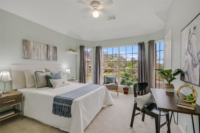 bedroom featuring light colored carpet, visible vents, and baseboards