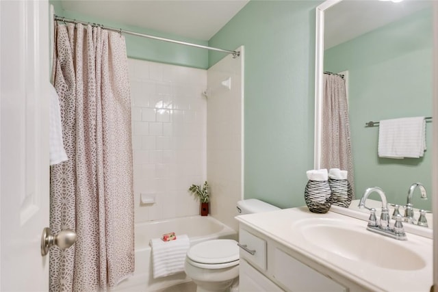 bathroom with toilet, shower / tub combo, and vanity