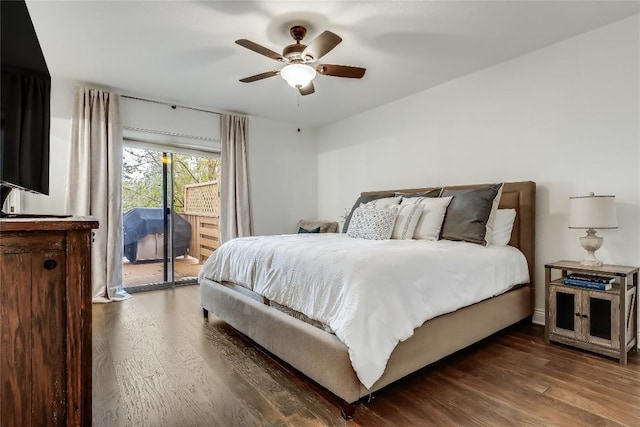bedroom featuring ceiling fan, wood finished floors, and access to exterior