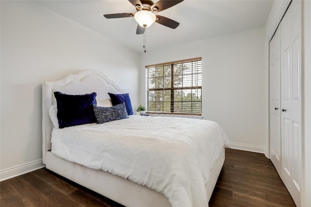 bedroom featuring a closet, baseboards, and wood finished floors