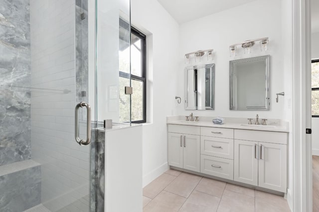 1105 Oak Hurst Rd, Austin, TX 78734 - full bath featuring plenty of natural light, double vanity, a shower stall, and tile patterned floors