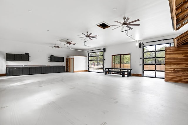 1105 Oak Hurst Rd, Austin, TX 78734 - garage featuring baseboards and a ceiling fan