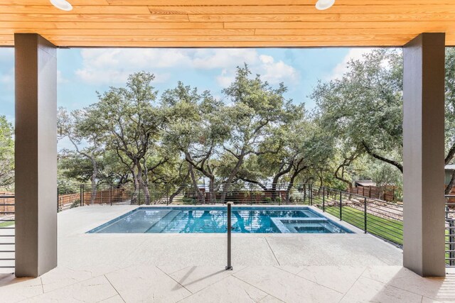 1105 Oak Hurst Rd, Austin, TX 78734 - view of swimming pool featuring an in-ground hot tub, a patio area, and a fenced backyard