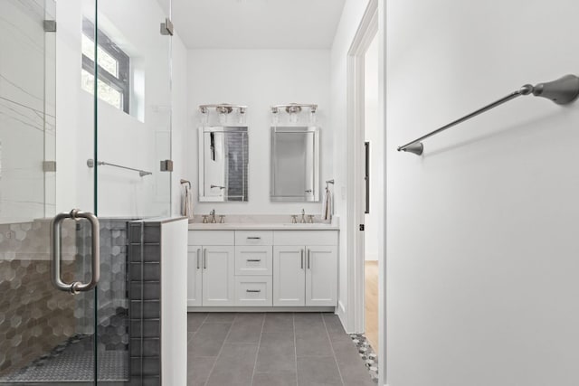 1105 Oak Hurst Rd, Austin, TX 78734 - bathroom with double vanity, tile patterned flooring, and a stall shower