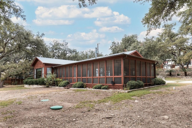 1105 Oak Hurst Rd, Austin, TX 78734 - view of front of property featuring a sunroom and a metal roof