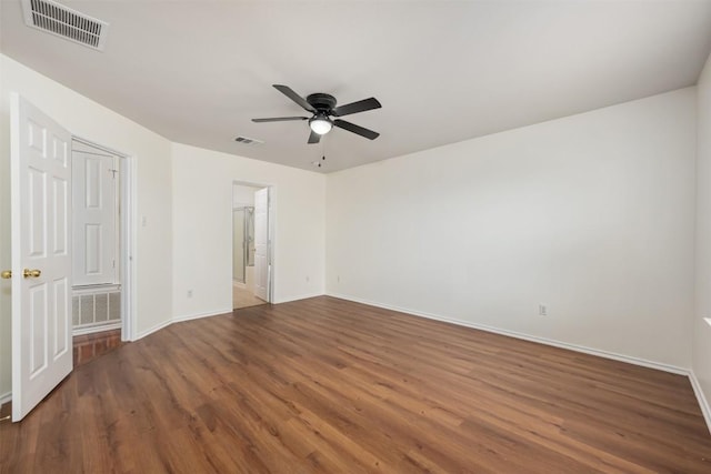 13412 Forest Sage St, Manor, TX 78653 - unfurnished bedroom with wood finished floors, baseboards, and ceiling fan