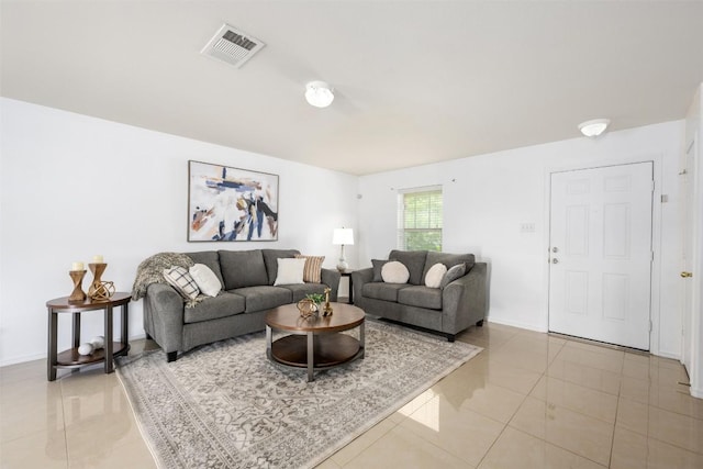 13412 Forest Sage St, Manor, TX 78653 - living room featuring light tile patterned floors and baseboards